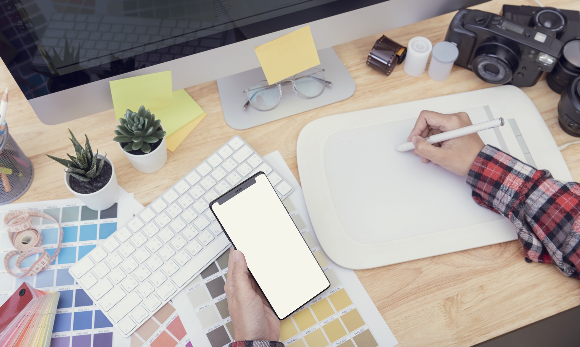 Top View of creative table working Place for graphic design.